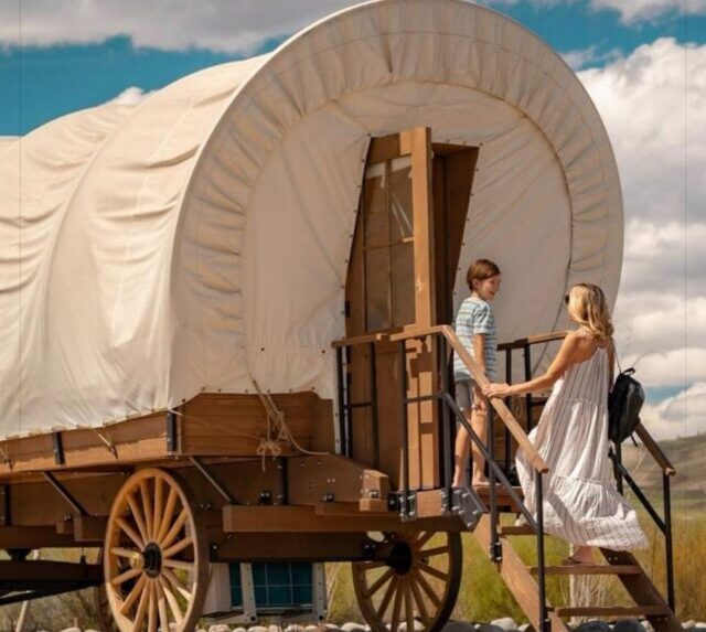 people entering covered wagon at Landing View in Branson, Mo